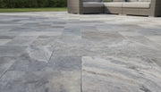 Close-up of Silver Travertine Tumbled French Versailles x 1.25 Paver, in Silver tones.