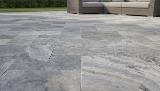 Close-up of Silver Travertine Tumbled French Versailles x 1.25 Paver, in Silver tones.