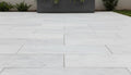 Close-up of Natural Carrara Equinox Marble Leather (Sandblasted & Brushed) 16 x 24 x 1.25 Paver, in Natural tones.