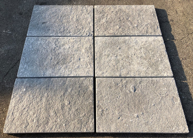 Close-up of Natural Indian Bluestone Limestone Tumbled 16 x 24 x 1.25 Paver, in Natural tones.