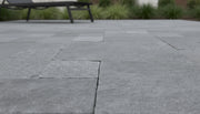 Close-up of Natural Indian Bluestone Limestone Tumbled French Versailles x 1.25 Paver, in Natural tones.
