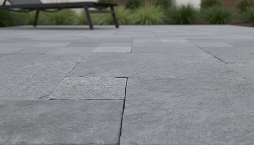 Close-up of Natural Indian Bluestone Limestone Tumbled French Versailles x 1.25 Paver, in Natural tones.