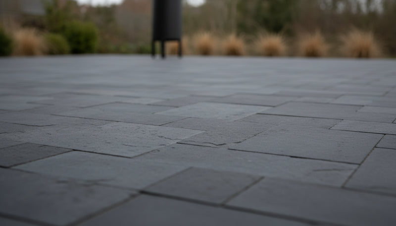 Close-up of Indian Black Limestone Tumbled French Versailles x 1.25 Paver, in Black tones.