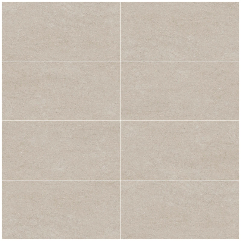 Pave Grigio rectangular porcelain tiles in an offset layout with warm grey concrete-effect surfaces and fine straight grout lines.
