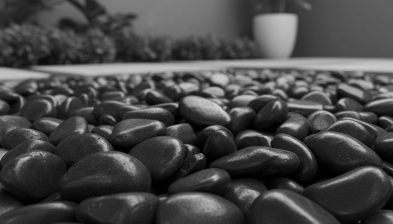 Close-up of Black Stone Polished 2 - 5CM (3/4 - 2 Inch) Medium Black Ultra Pebbles, in Black tones.