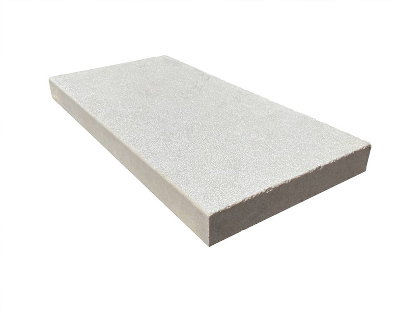 Close-up of Antalya Cream Marble Leather (Sandblasted & Brushed) 12 x 24 x 2 Modern Coping, in Cream tones.