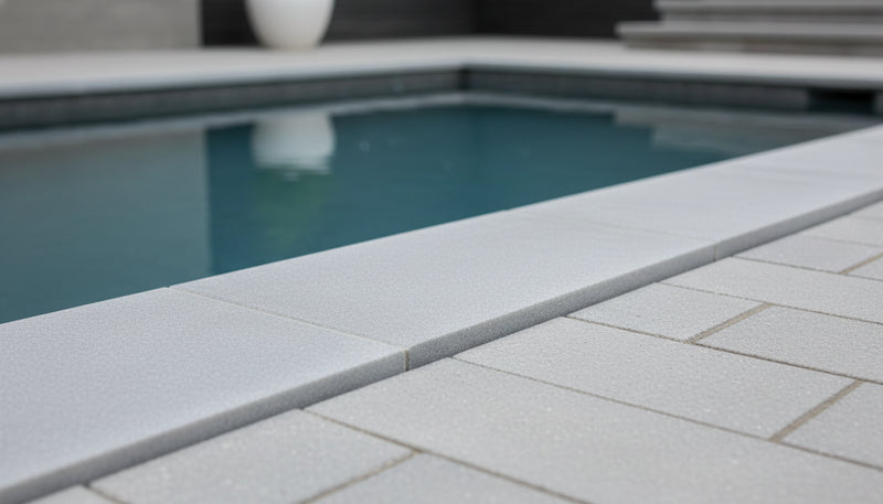 Close-up of Blue Island Marble Leather (Sandblasted & Brushed) 12 x 24 x 2 Double Modern Coping, in Blue Island tones.