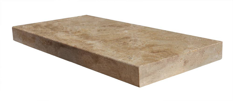 Close-up of Chocolate Brown Walnut Travertine Tumbled 12 x 24 x 2 Modern Coping, in Brown tones.