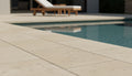 Close-up of Autumn Leaves Scabos Travertine Tumbled 16 x 24 x 2 Modern Coping, in Autumn tones.