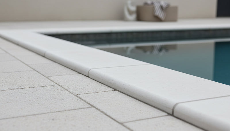 Close-up of Desert Sand Limestone Tumbled 16 x 24 x 2 Double Modern Coping, in Desert Sand tones.