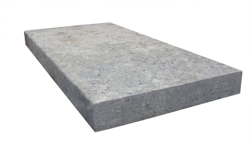 Close-up of Silver Travertine Tumbled 12 x 24 x 2 Modern Coping, in Silver tones.