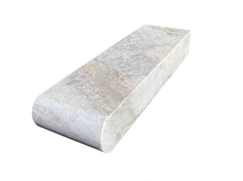 Close-up of Silver Travertine Tumbled 4 x 12 x 2 Bullnose Coping, in Silver tones.