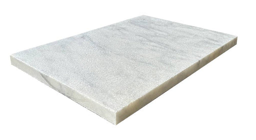 Close-up of Natural Carrara Equinox Marble Leather (Sandblasted & Brushed) 16 x 24 x 2 Modern Coping, in Natural tones.