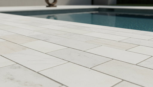 Close-up of Natural Carrara Equinox Marble Leather (Sandblasted & Brushed) 16 x 24 x 2 Modern Coping, in Natural tones.