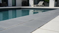 Close-up of Indian Black Limestone Tumbled & Brushed 12 x 24 x 2 Modern Coping, in Black tones.