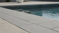 Close-up of Natural Aqua Dolce Sandstone Flamed 12 x 24 x 2 Modern Coping, in Natural tones.