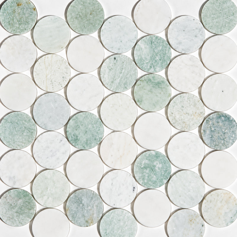 Pale green and white penny round marble mosaic with natural veining and circular tiles.