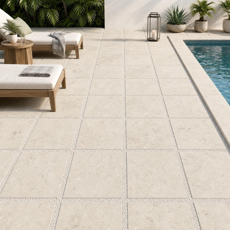 Platinum Ice 24x24 Tumbled Limestone Paver — Backyard pool deck