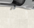 Close-up of Tivoli Beige Porcelain Rough & Straight Edge 24 x 24 x 3/4 Paver, in Beige tones.