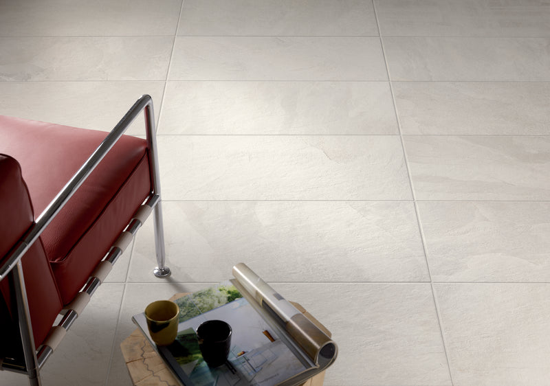 Close-up of Tivoli Beige Porcelain Rough & Straight Edge 24 x 24 x 3/4 Paver, in Beige tones.