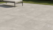Close-up of Cement Grey Porcelain Rough & Straight Edge 24 x 24 x 3/4 Paver, in Grey tones.