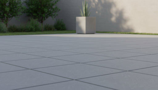 Close-up of Bluestone Light Grey Porcelain Rough & Straight Edge 24 x 24 x 3/4 Paver, in Grey tones.