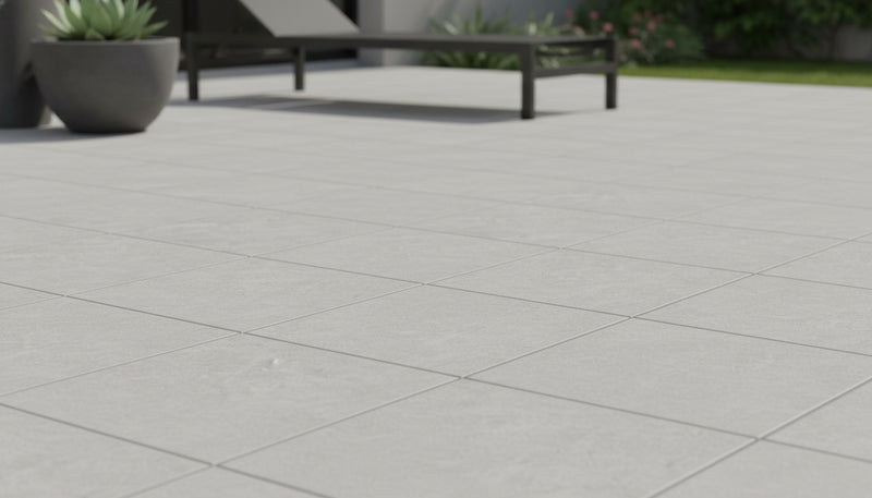 Close-up of Astro Grey Porcelain Rough & Straight Edge 24 x 24 x 3/4 Paver, in Grey tones.
