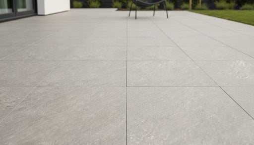 Close-up of Astro Grey Porcelain Rough & Straight Edge 24 x 48 x 3/4 Paver, in Grey tones.