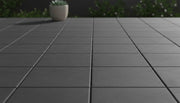 Close-up of Natural Envy Dark Porcelain Rough & Straight Edge 24 x 24 x 3/4 Paver, in Natural tones.