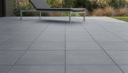 Close-up of Envy Grey Porcelain Rough & Straight Edge 24 x 24 x 3/4 Paver, in Grey tones.