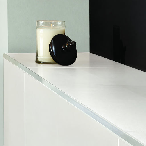 Pure White 12x24 polished porcelain tile surface with a smooth white finish and very subtle tonal variation.