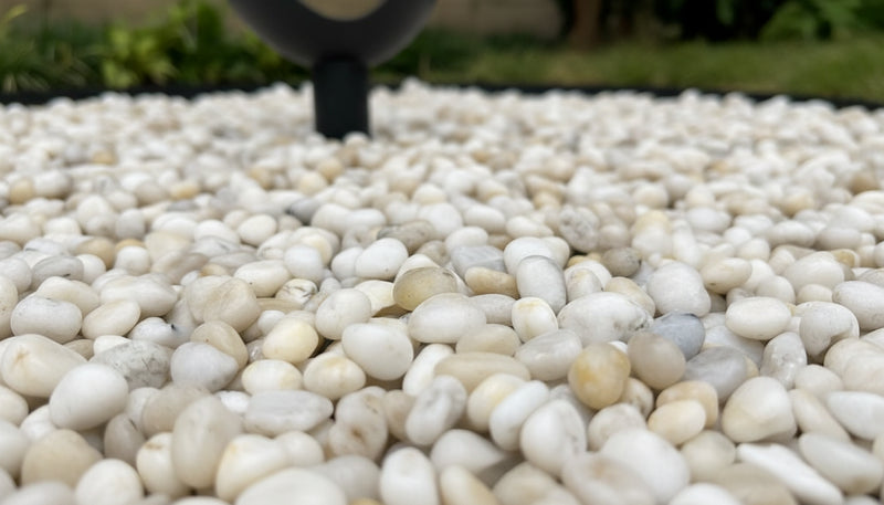 Close-up of White Stone Polished 1.2 - 1.6CM (1/2 - 5/8 Inch) Small White Ultra Pebbles, in White tones.