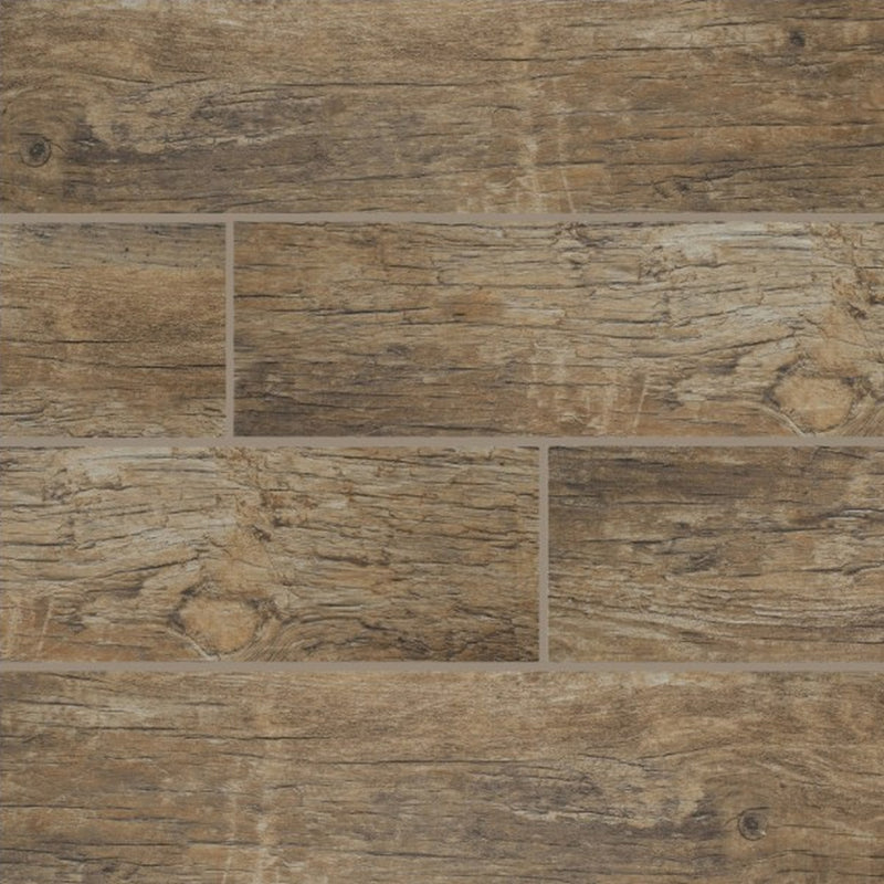 Close-up of Redwood Natural matte porcelain planks with beige-brown wood grain, knots and staggered joints.