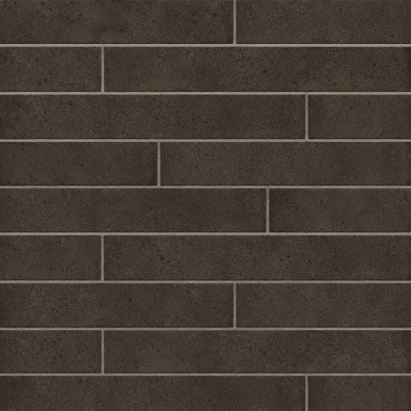 Rondine Nolita Charcoal 2x18 matte porcelain tiles with a rustic charcoal texture arranged in horizontal rows.