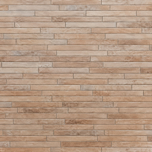 Rondine Nolita Sand 2x18 porcelain tile in sand beige with narrow rectangular tiles in a staggered layout.