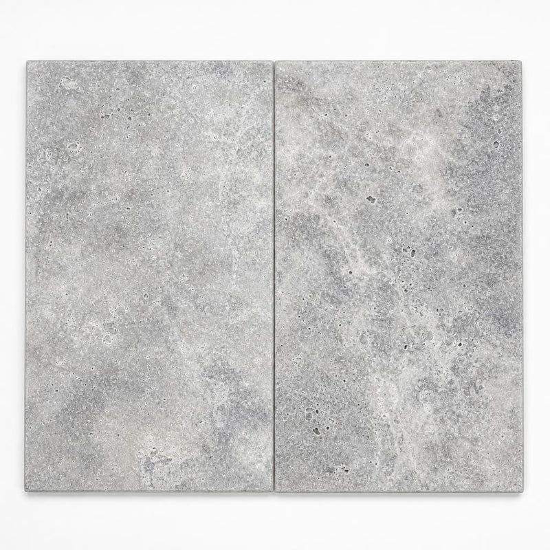 Silver 12x24x2 Unfilled & Honed Travertine Beveled Pool Coping close-up