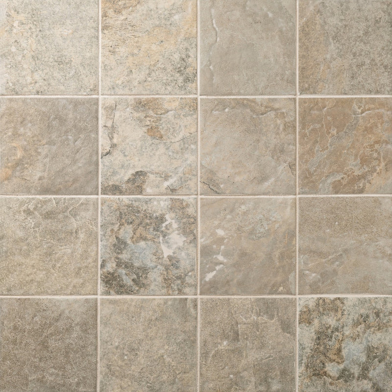 Sinai Beige matte porcelain tiles in a square grid with varied beige and gray stone-look patterns.