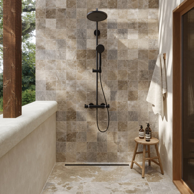 Sinai Beige porcelain shower wall tiles with matte black fixtures and warm natural lighting.