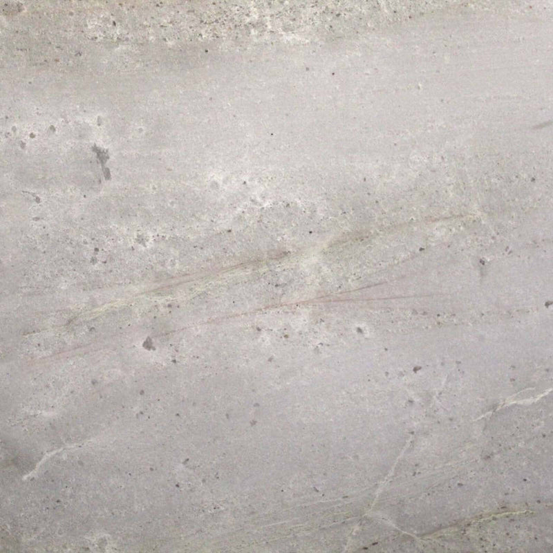 Aurora White polished quartzite surface detail with a pale grey and ivory background, soft sweeping mineral bands, and scattered small darker crystalline inclusions.
