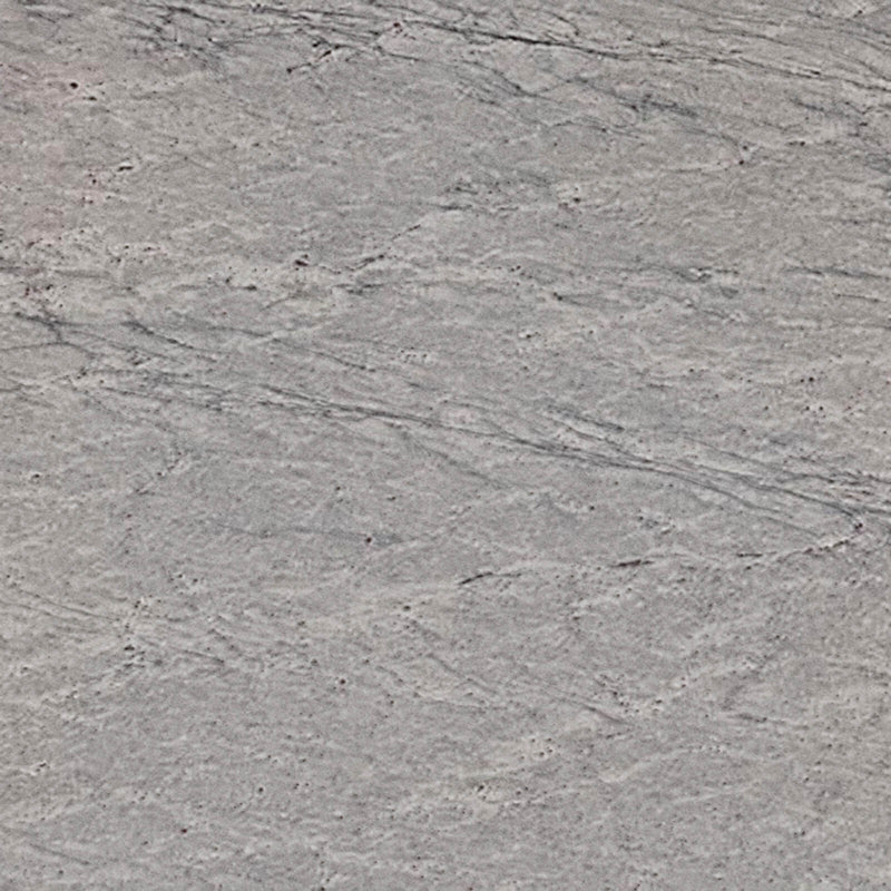 Thunder White 2cm polished granite slab close-up with light gray tones, flowing gray veins and tiny dark speckles.