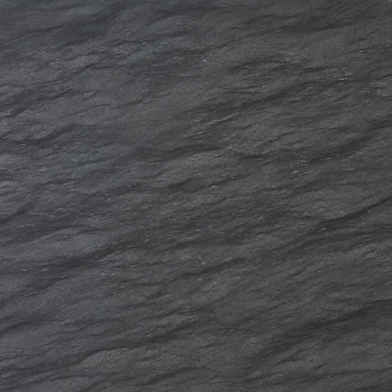 Black Vermont 2cm Deep Tek granite slab with a dark charcoal-gray surface, subtle diagonal bands and fine natural texture.