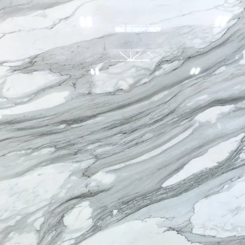SLABMRE Calacatta Borghini Mist 2cm honed marble slab showing a white background with flowing gray veining.
