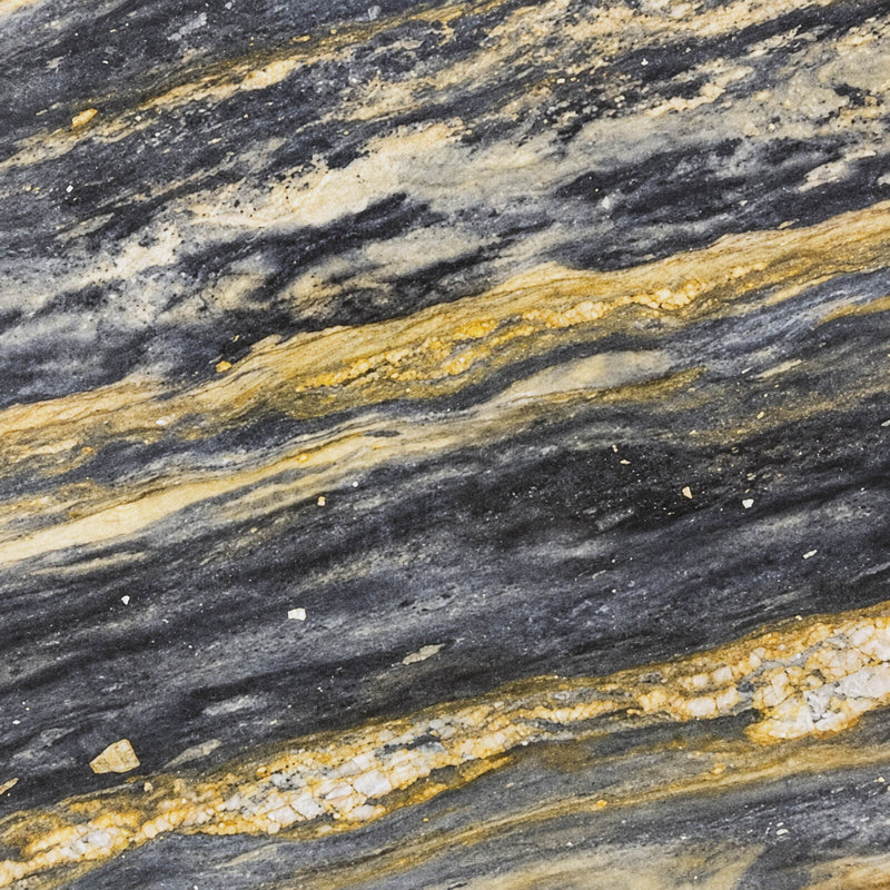 Elysium polished quartzite slab close-up with diagonal charcoal gray bands, golden veins and cream mineral clusters.