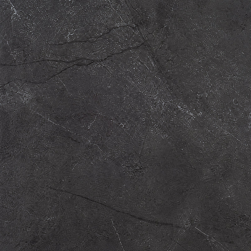Close-up of St. Croix Flint 12x24 porcelain tile showing its charcoal-gray surface and subtle stone-look veining.