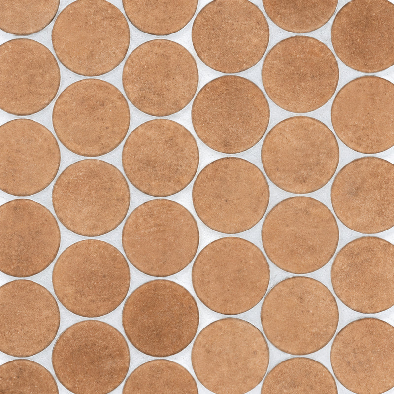 Stage Penny Terracotta 2x2 pennyround natural porcelain mosaic with warm terracotta circular tiles and light gray grout.