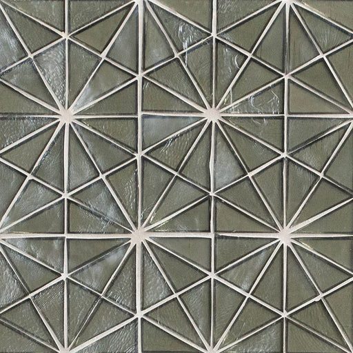 Close-up of Stella Grigia geometric glass mosaic tile in gray tones