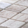 Angled close-up of STO-RE Ocean White polished marble mosaic tiles
