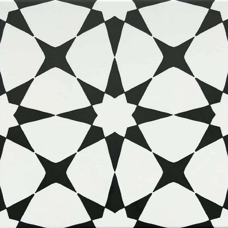 Studio Nova 8x8 square matte porcelain tile with a black and white geometric star pattern.