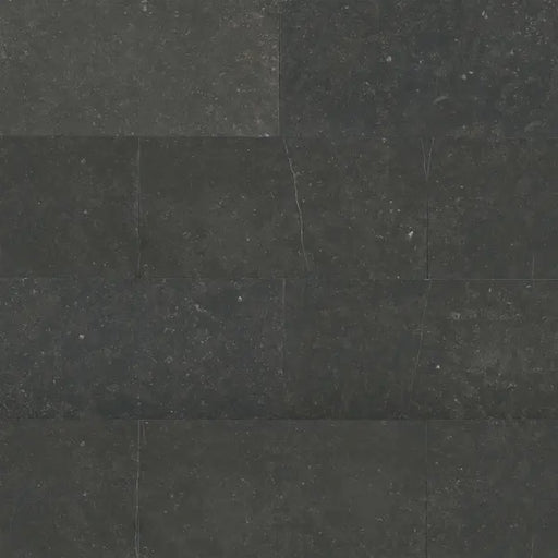 Dark charcoal Suave Due Pecora Nera 31.5x15.75 smooth limestone tile with subtle natural speckling.