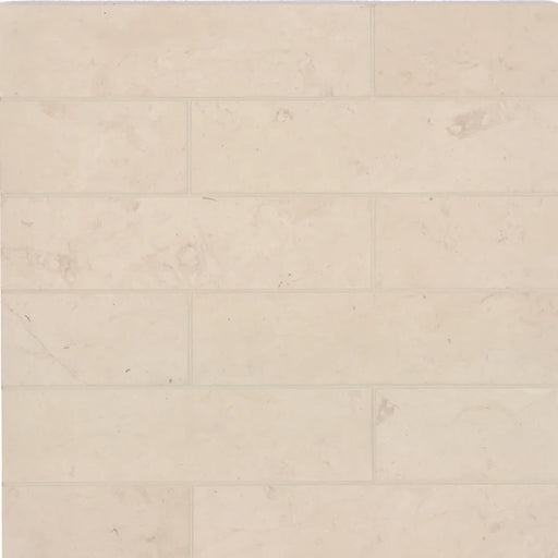 Suave Fleece 16x4 smooth finish limestone tile in a light beige staggered pattern.